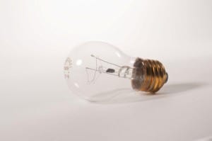 Incandescent lightbulb on white background for a photography project.