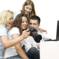 A group of people learning tips on writing a photo blog.
