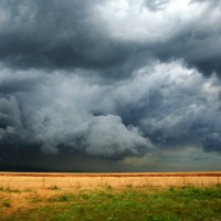 Photo of a spring thunder storm moving across a farm.