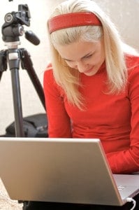 Photographer with a laptop making a website