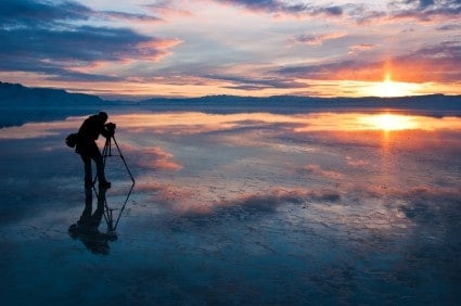 Photographer learning the craft as he shoots a sunrise