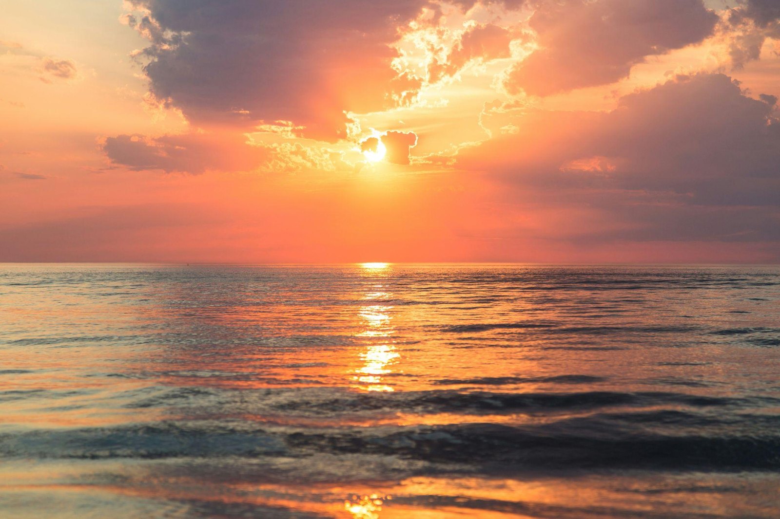 Bright sunset sky over a darker foreground